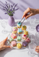 Colorful Pastry Collection on Elegant Tiered Dessert Stand for Celebrations