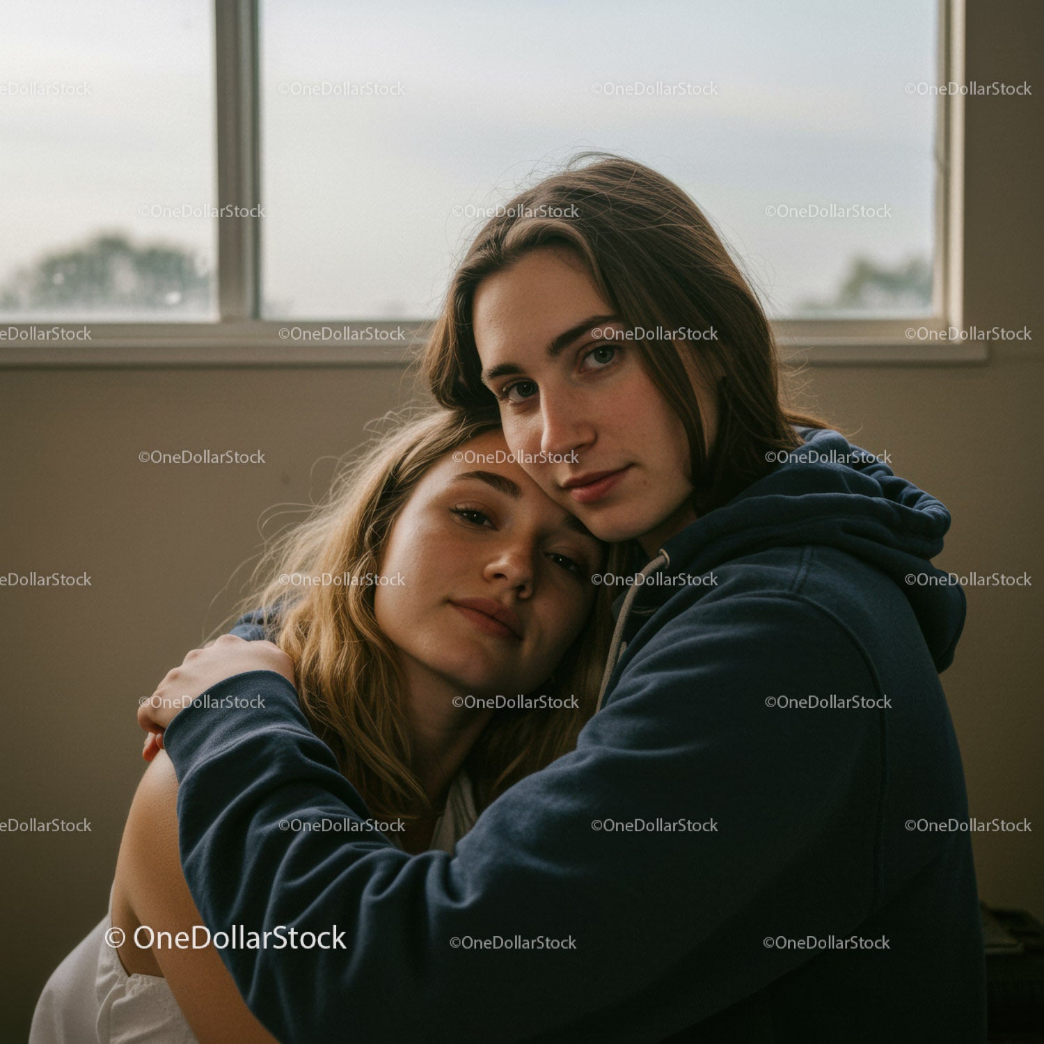 Young Romantic Couple Embracing Indoors in Cozy Atmosphere