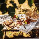 Rustic Picnic Table with Fresh Bread and Cheese Spread