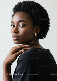 Elegant Portrait of a Black Woman with Natural Hair and Pearl Earrings