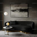Modern black sofa with gold accents in cozy living room