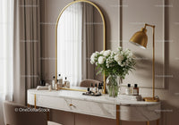 Elegant vanity table with floral decor and golden lamp