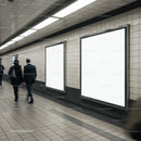 Empty advertising boards in busy subway corridor