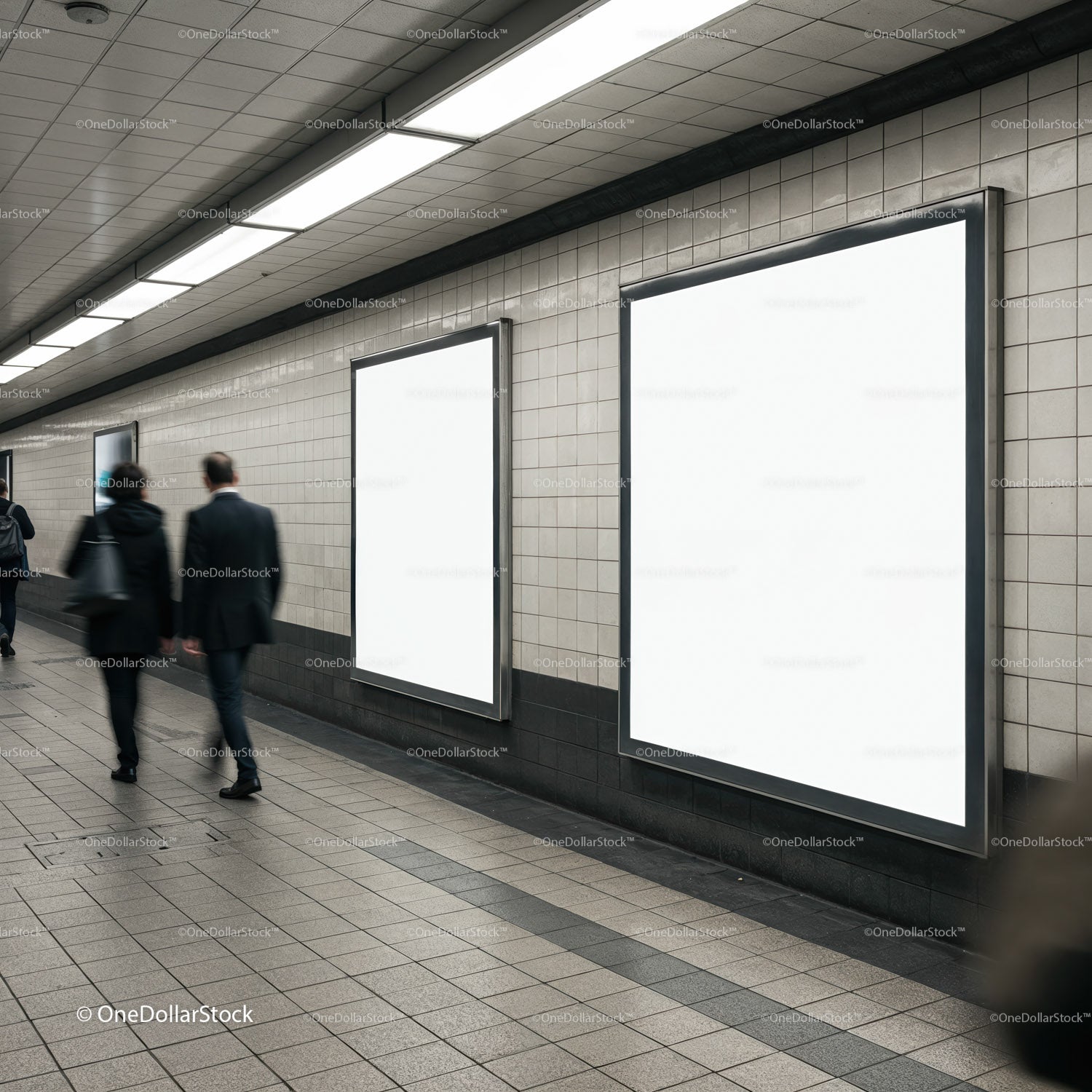 Empty advertising boards in busy subway corridor