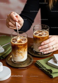 Refreshing Iced Coffee with Milk Swirls in Stylish Glasses