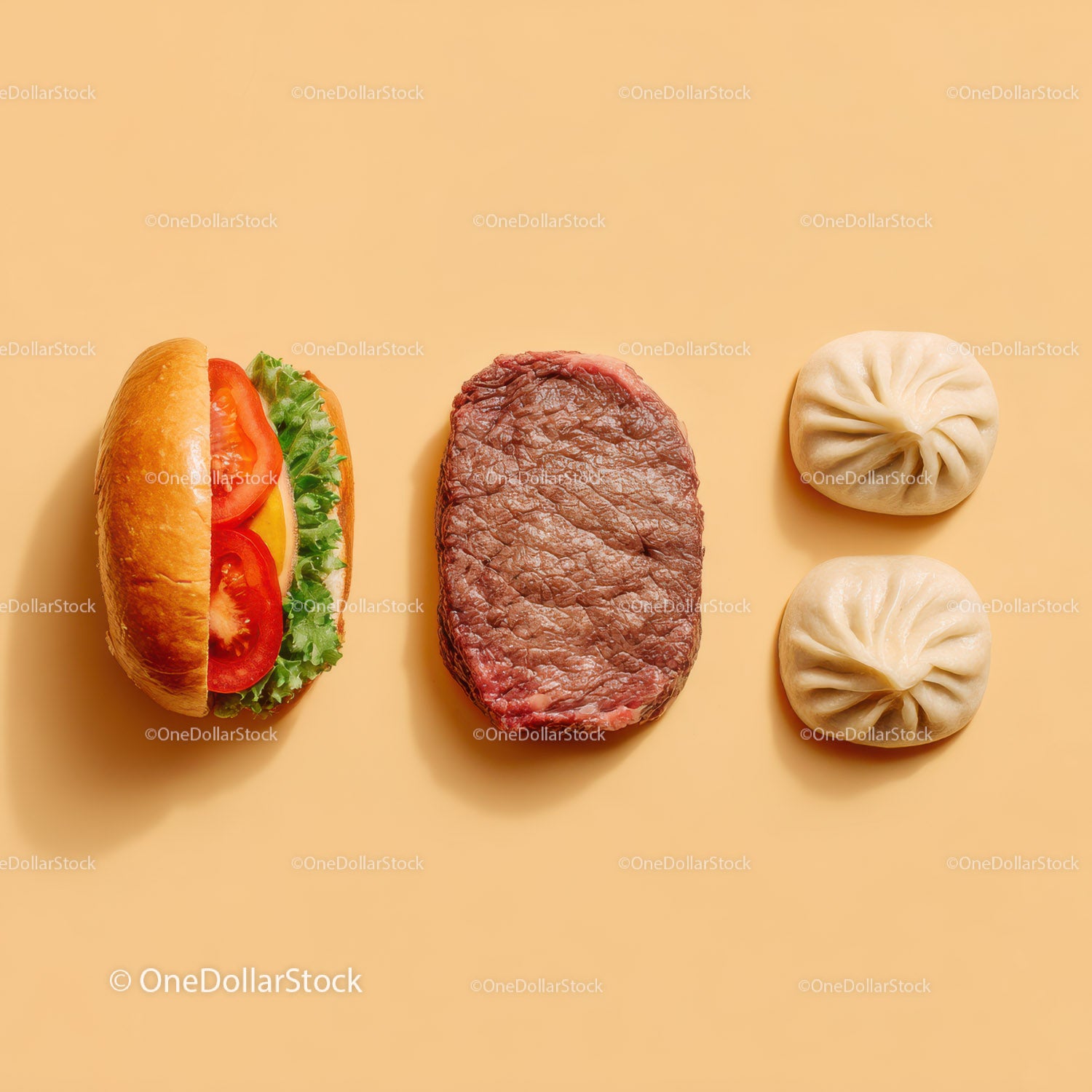 Gourmet Burger with Lettuce and Tomato Next to Grilled Steak and Dumpling