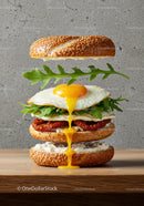 Deconstructed egg sandwich with fresh arugula and sun-dried tomatoes