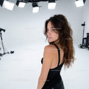 Stylish Female Model in Black Dress with Studio Lighting