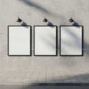 Blank Posters on Concrete Wall with Street Lamps