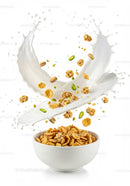 Crispy cereal with nuts splashing into fresh milk