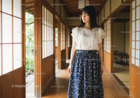 Young Woman in Casual Outfit Inside Traditional Japanese House