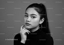 Elegant Black and White Portrait of a Confident Woman with Stylish Earrings