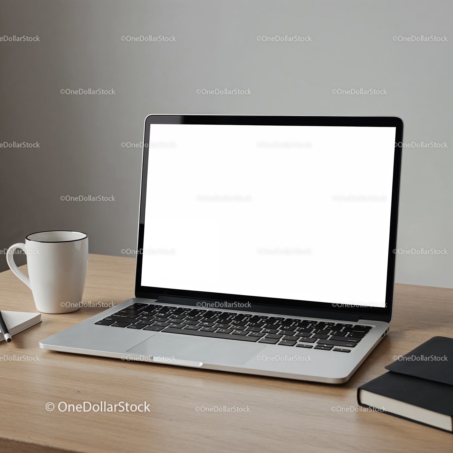 Modern laptop with coffee cup and notebook on desk