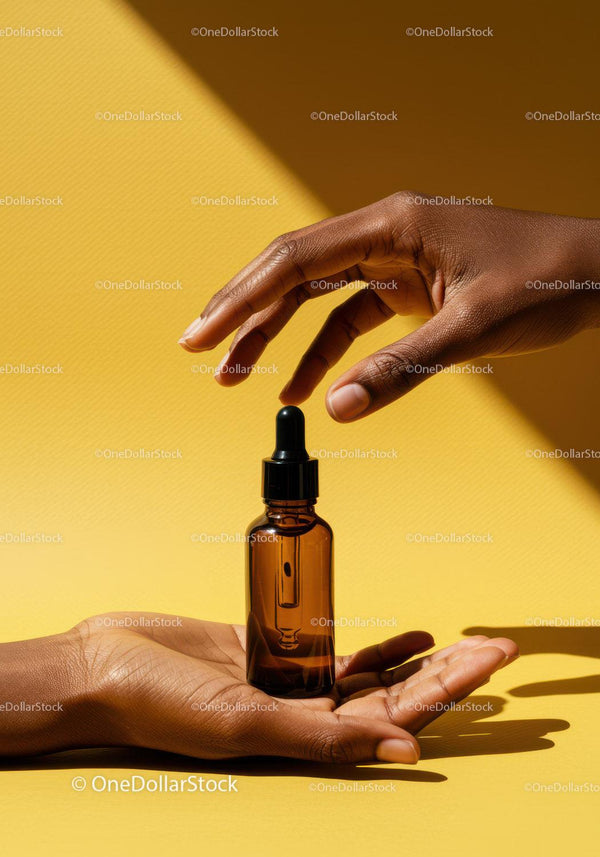 Elegant Hand with Dropper and Skincare Bottle on Yellow Background JPG Mockup Image