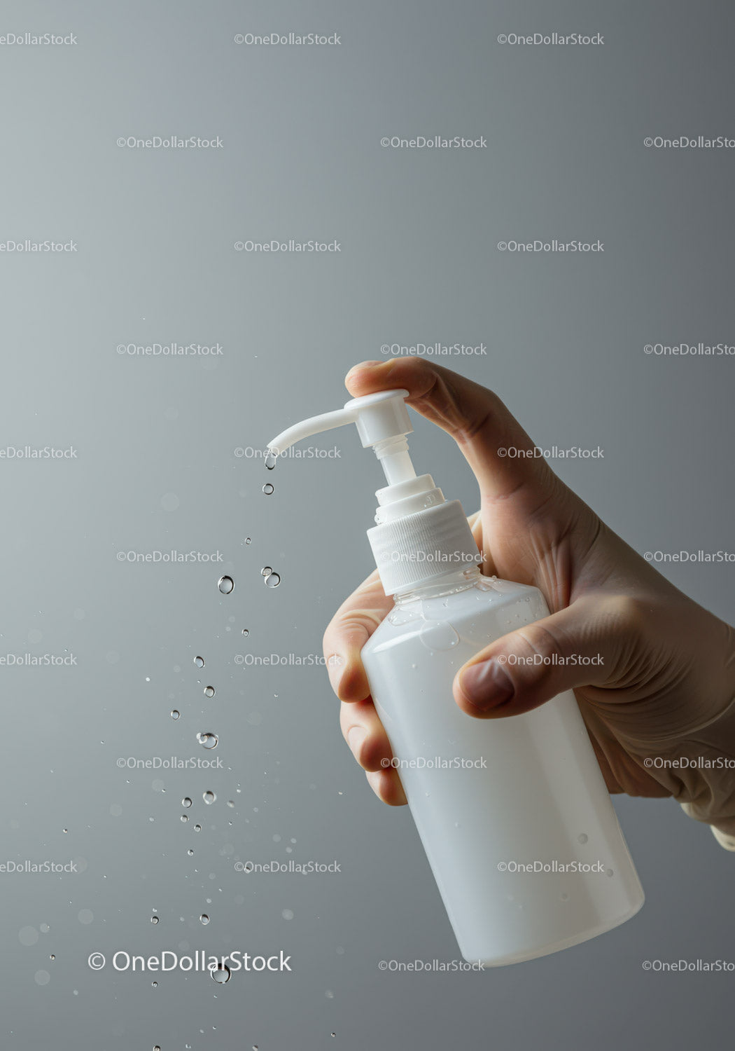 Hand Pumping Liquid Soap in a Clear Pump Bottle for Hygiene