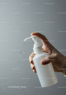 Hand Pumping Liquid Soap in a Clear Pump Bottle for Hygiene