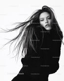 Elegant Black and White Fashion Portrait of a Woman with Flowing Hair