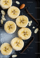 Sliced Bananas with Sugar and Vanilla Beans on Black Tray