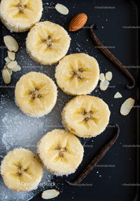 Sliced Bananas with Sugar and Vanilla Beans on Black Tray