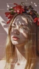 Young Woman with Red Floral Crown and Purple Grapes Outdoor Portrait
