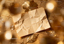 Wrinkled brown paper on embossed golden floral surface JPG Mockup Image preview