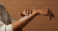 Close-Up of Hands Applying Body Lotion on Arm for Skin Moisturization
