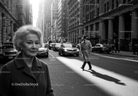 Elderly Woman in Busy City Street Surrounded by Vintage Cars