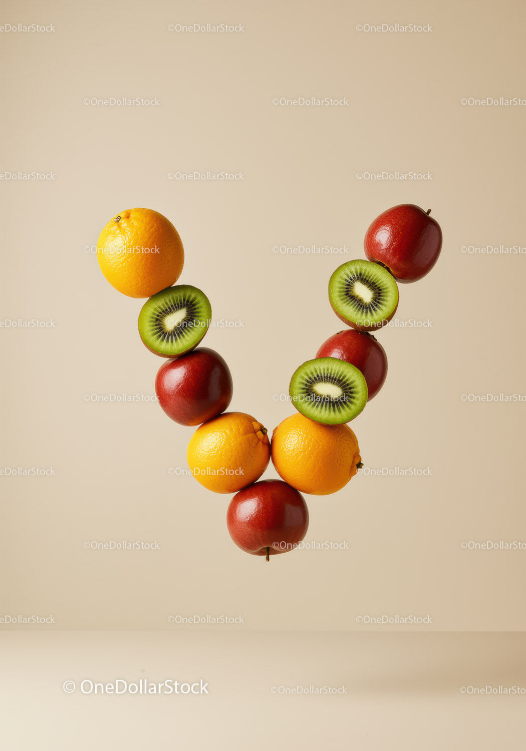 Creative fruit arrangement with apples oranges and kiwis