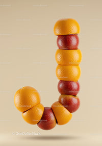 Creative letter J made of apples and orange segments