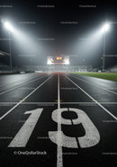 Night View of Numbered Lane on Empty Running Track