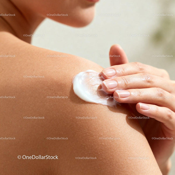 Close-Up of Woman Applying Cream to Shoulder