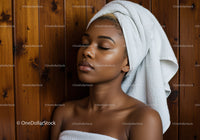 Serene Young Woman Relaxing with Towel Wrap in Spa Setting