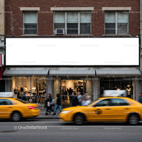 Urban street scene with clothing store and yellow taxis
