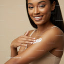 Portrait of a Beautiful Woman Smiling While Applying Sunscreen on Her Shoulder