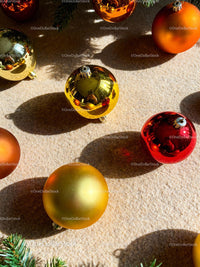 Festive Christmas Ornaments on Soft Beige Surface