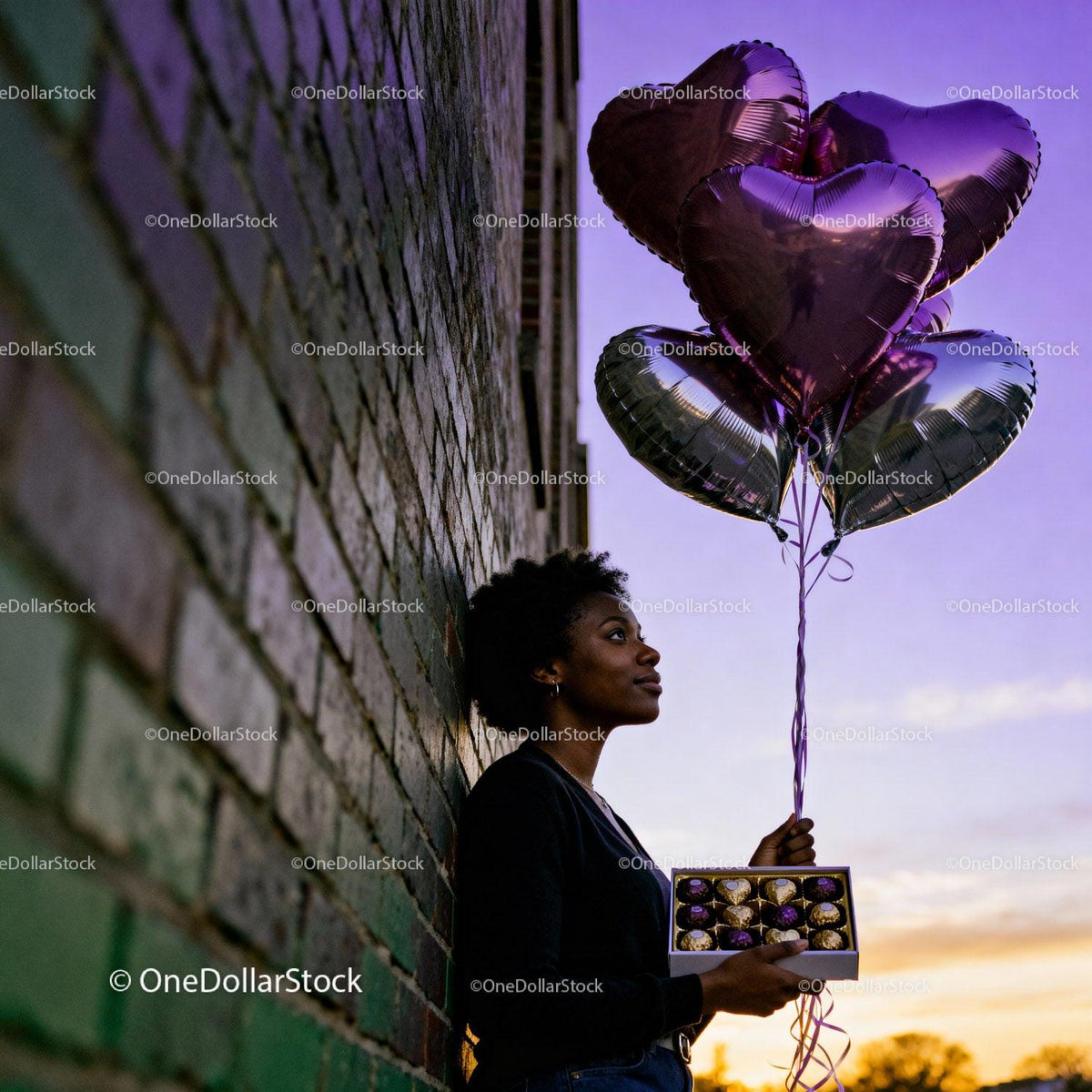 Woman Holding Heart Balloons And Chocolates At Sunset