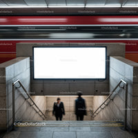 Blurred commuters entering urban subway station stairs