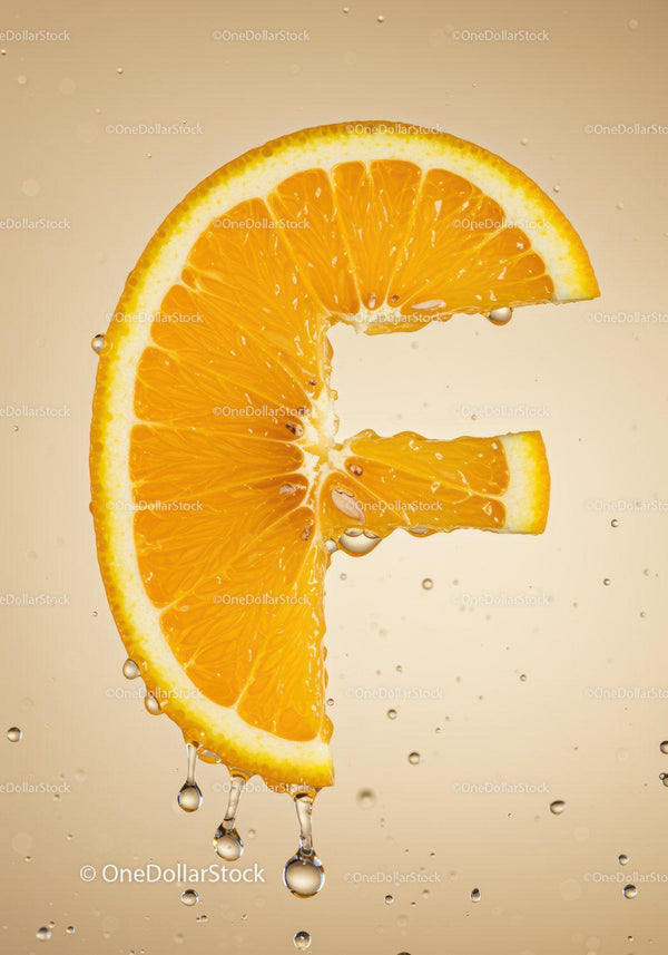Fresh orange slice with water droplets closeup