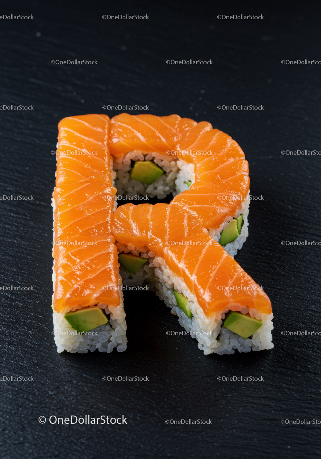 Sushi Rolls Shaped as Letter R with Salmon and Avocado