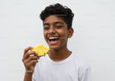 Joyful Child with Pineapple Enjoying Tropical Summer Moment