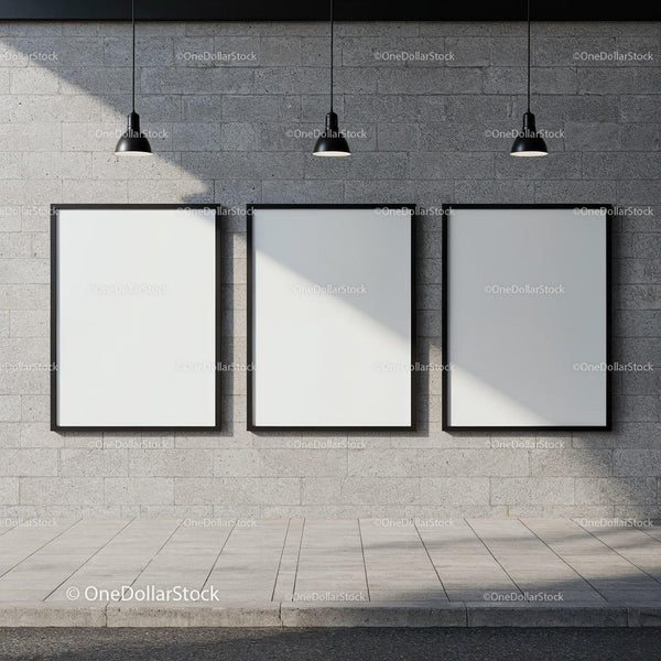 Three blank posters on concrete wall under pendant lights JPG Mockup Image
