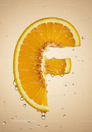 Fresh orange slice shaped like letter F with water droplets