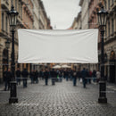 Blank white banner between vintage street lamps on city street