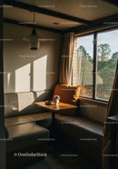 Sunlit Cozy Corner with Wooden Table and Flower Vase in Living Room
