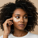 Woman with Curly Hair Applying Under Eye Patches for Skincare
