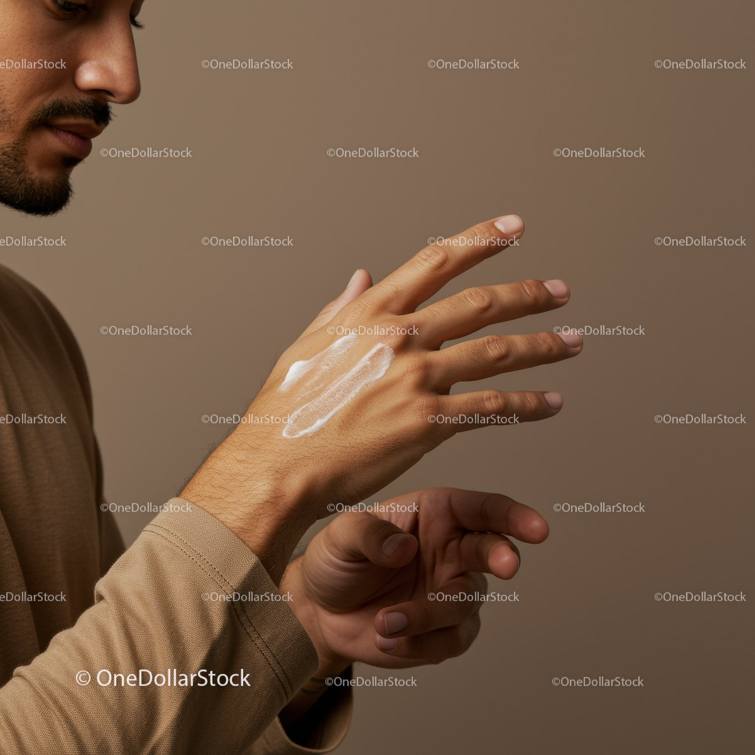 Man Applying Sunscreen Lotion on Hand for Skin Protection