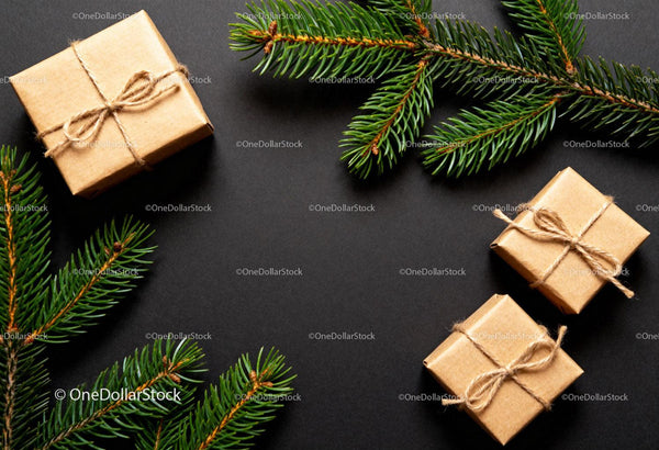 Minimalist Christmas gifts and fir branches on black