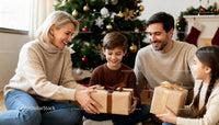 Family exchanging Christmas gifts by decorated tree