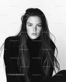 Black and White Portrait of a Young Woman with Long Hair and Intense Gaze