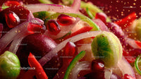 Close-up of Fresh Pomegranate Seeds and Lime Slices with Vegetables